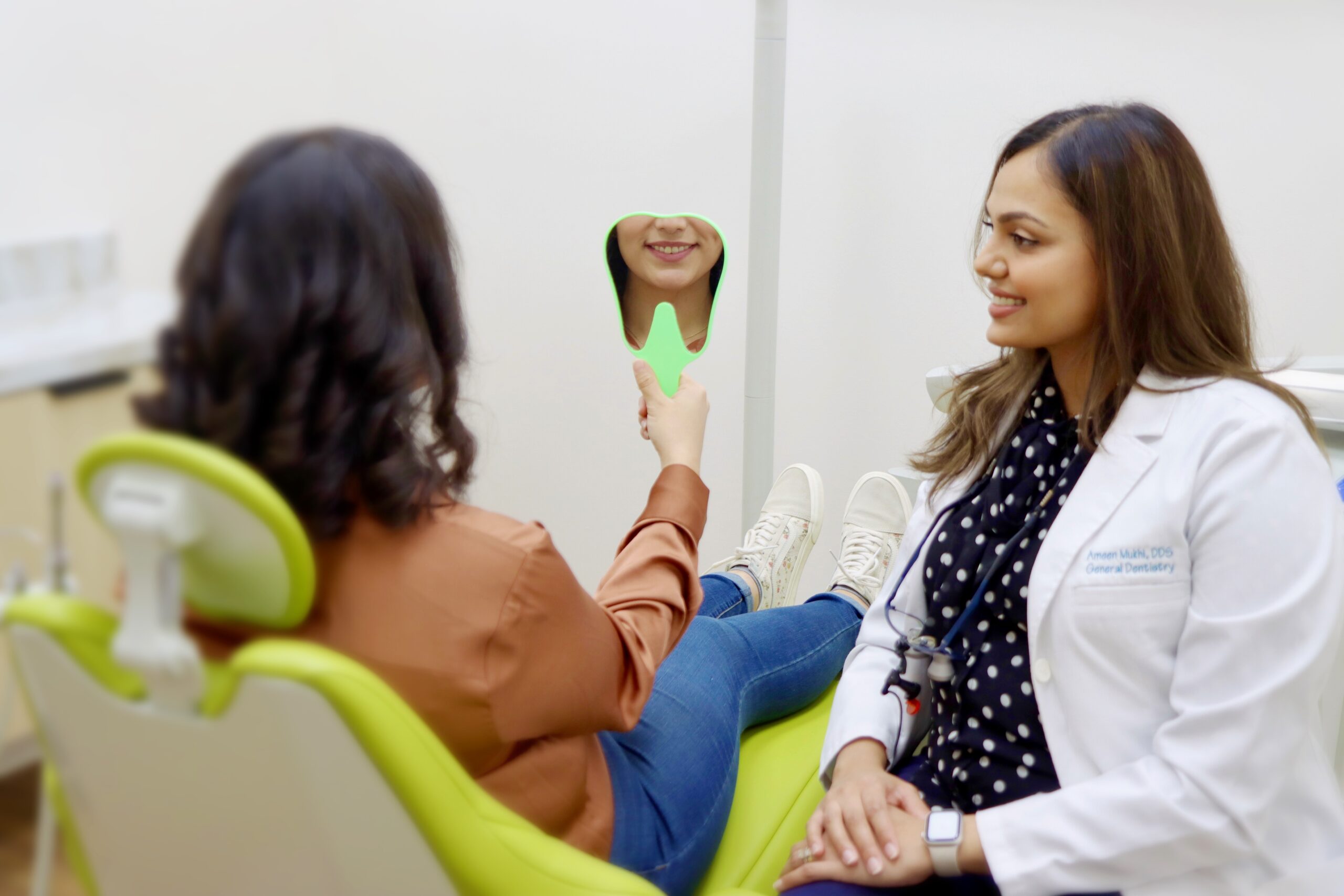 Dentist and smiling patient- Evergreen dental TX (Restorative Dentistry)